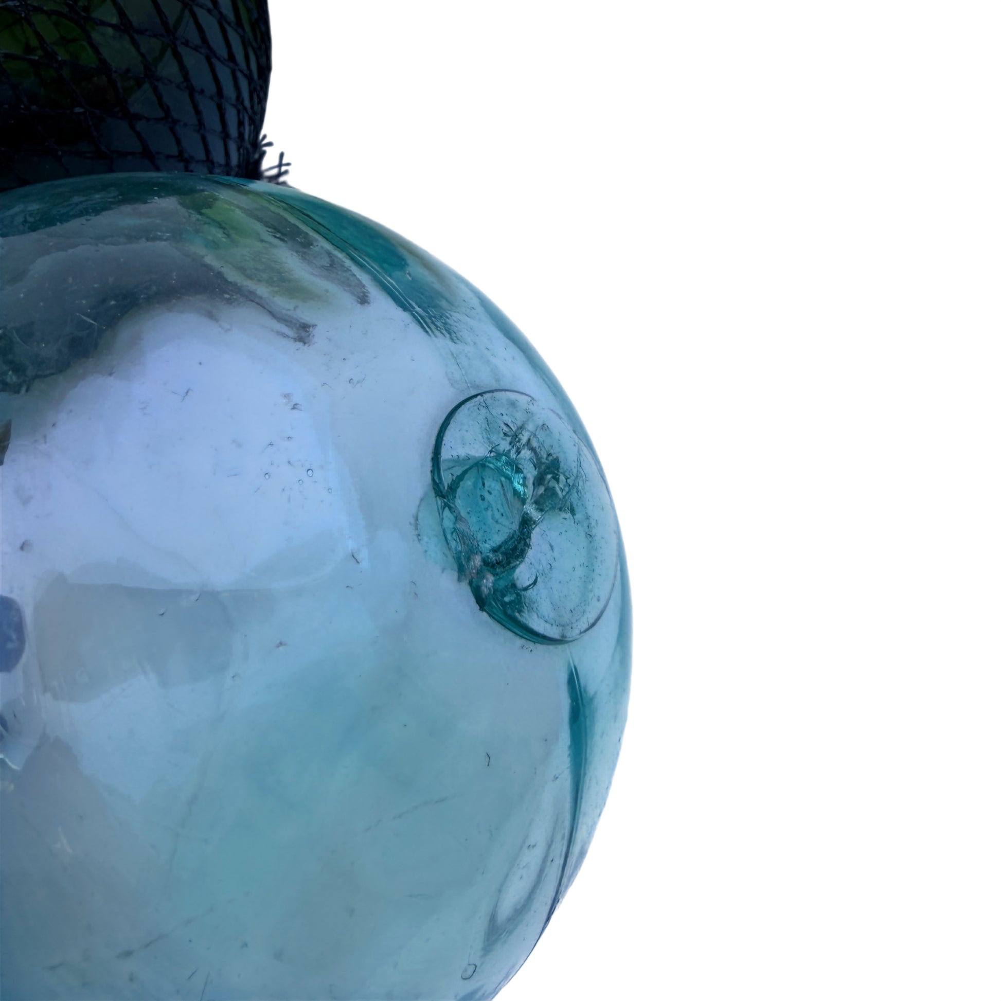 Group of glass fishing floats in varying sea-green and aqua colours for nautical decor