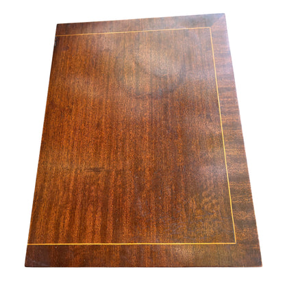 Angled right side view of tall narrow chest showing plain mahogany veneered side panel