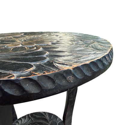 Side view showing carved leg and scrolled foot on hardwood occasional table