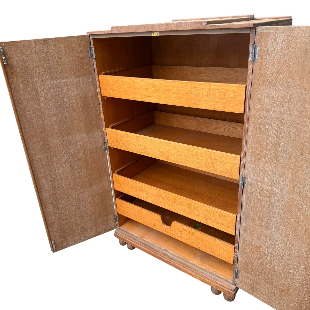 Edge of top showing veneer chips and light splintering on oak cupboard