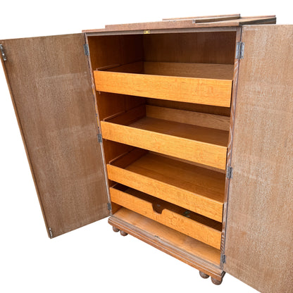 Edge of top showing veneer chips and light splintering on oak cupboard