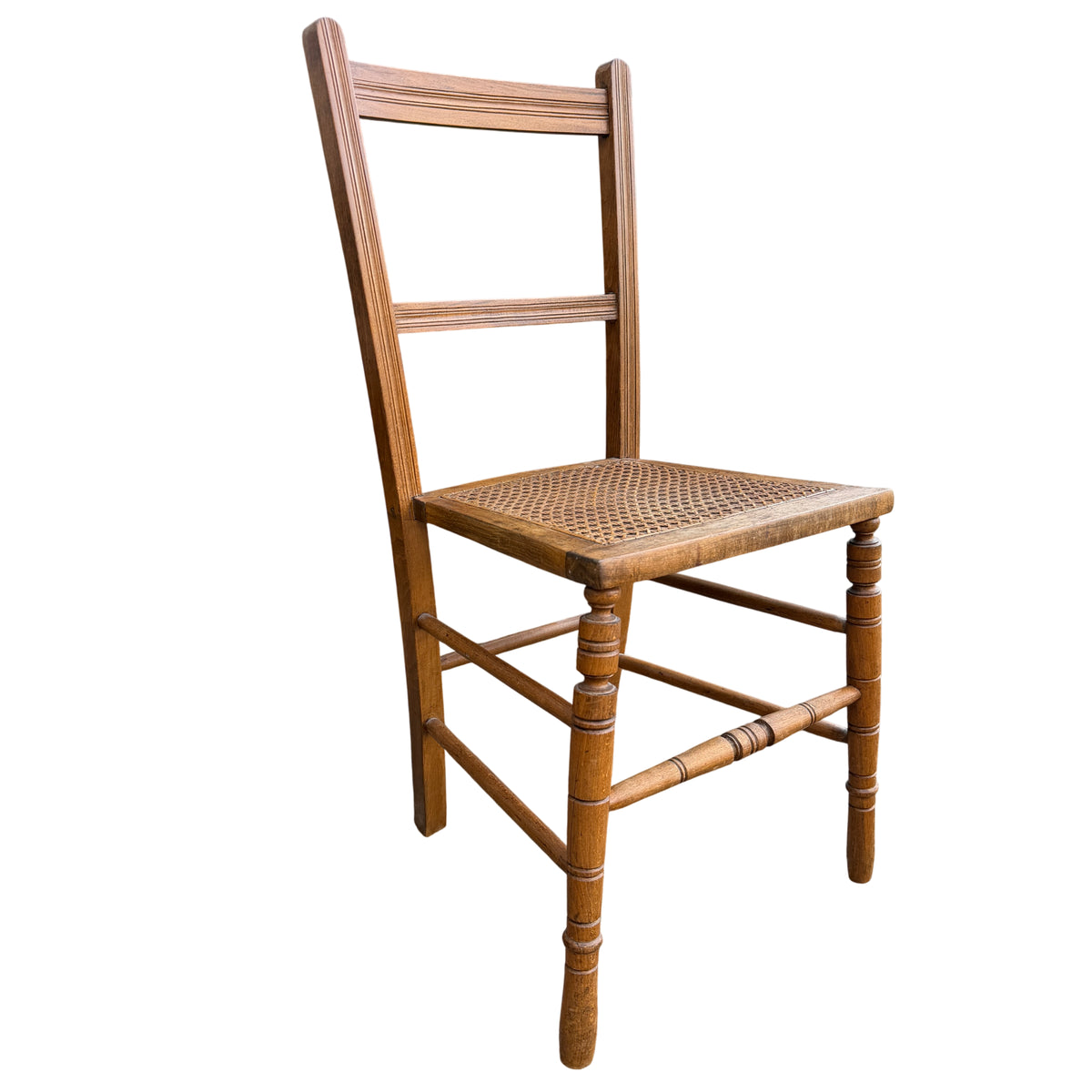 Lower stretcher and turned legs of vintage ladderback dining chair