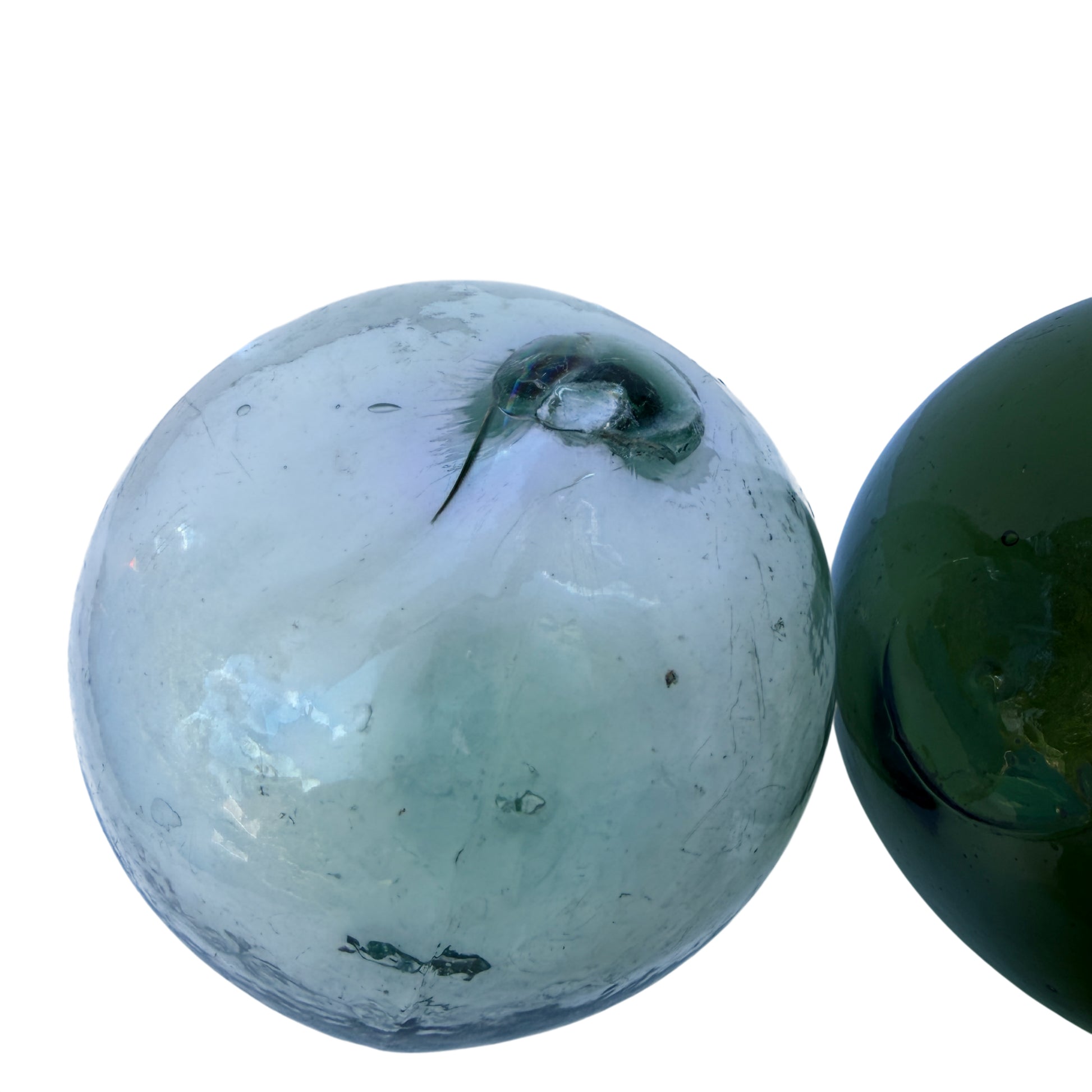 Assorted vintage glass orbs for maritime display in sea-green and aqua tones