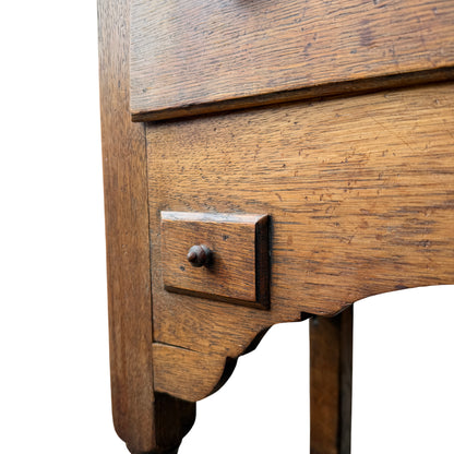 Side view of solid oak dresser showing fixed top and shelf overhang