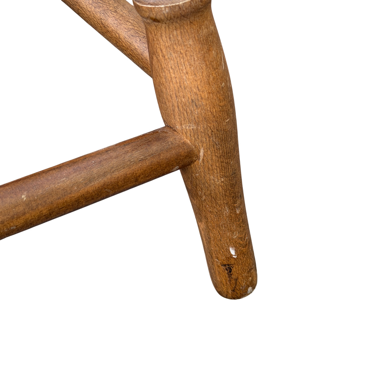 Close-up of turned leg with subtle beading detail on wooden stool