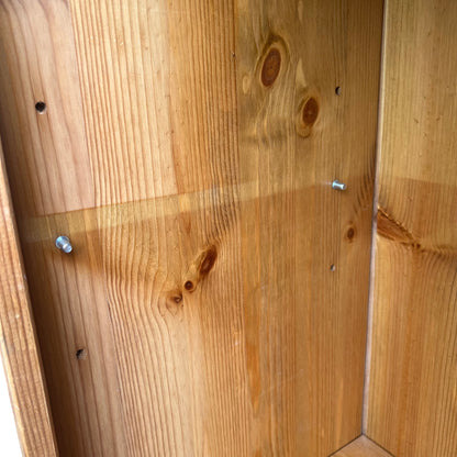 Side view of pine bookcase showing vertical moulded side stiles