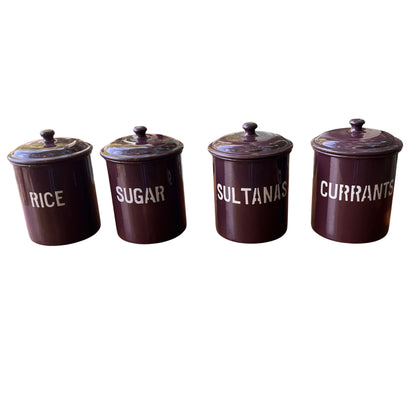 Set of four vintage purple enamel kitchen canisters labelled Rice Sugar Sultanas Currants on a wooden table