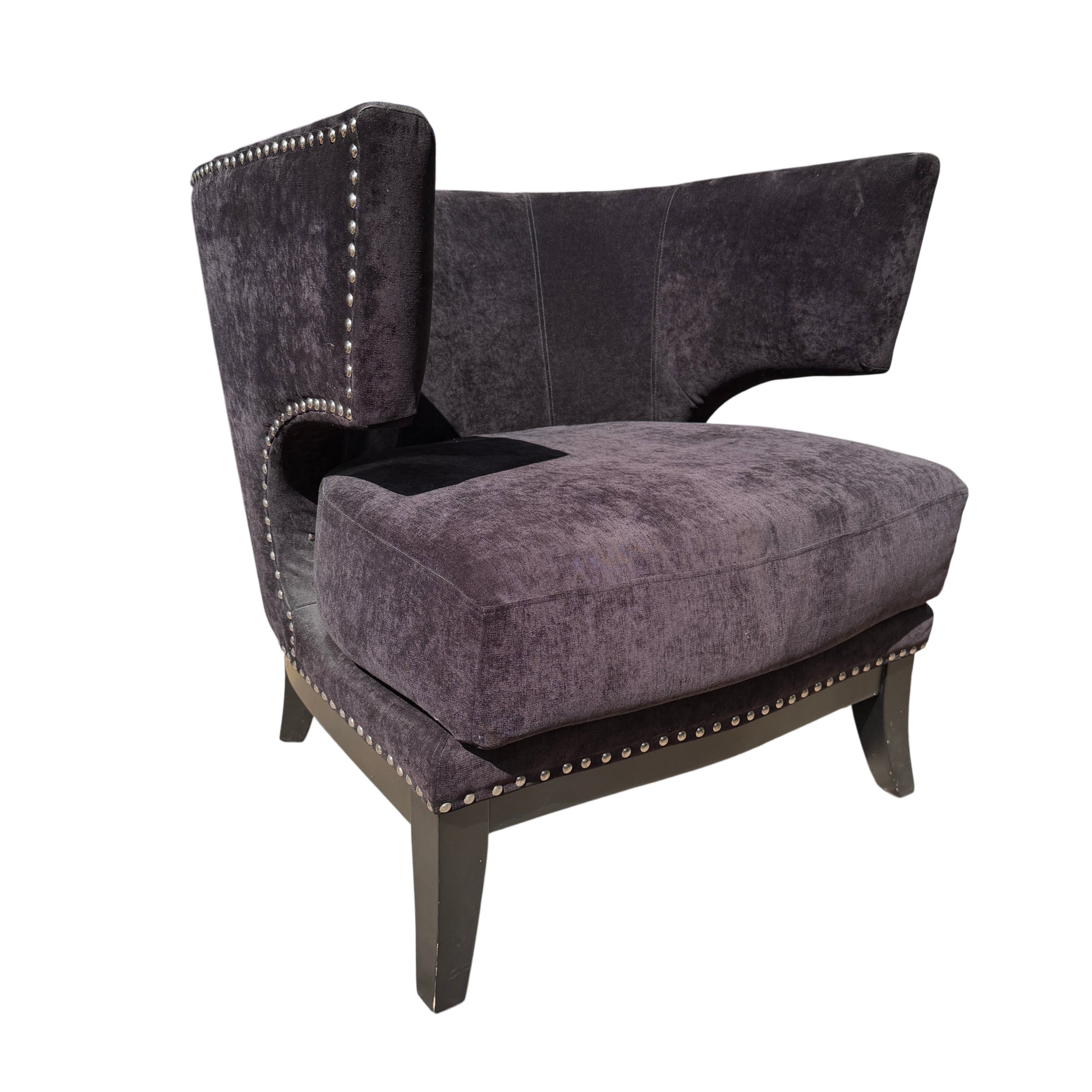 Black upholstered wingback armchair with stud trim and removable cushion on timber legs
