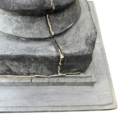 Base plinth showing cracks and age wear on reclaimed timber pedestal