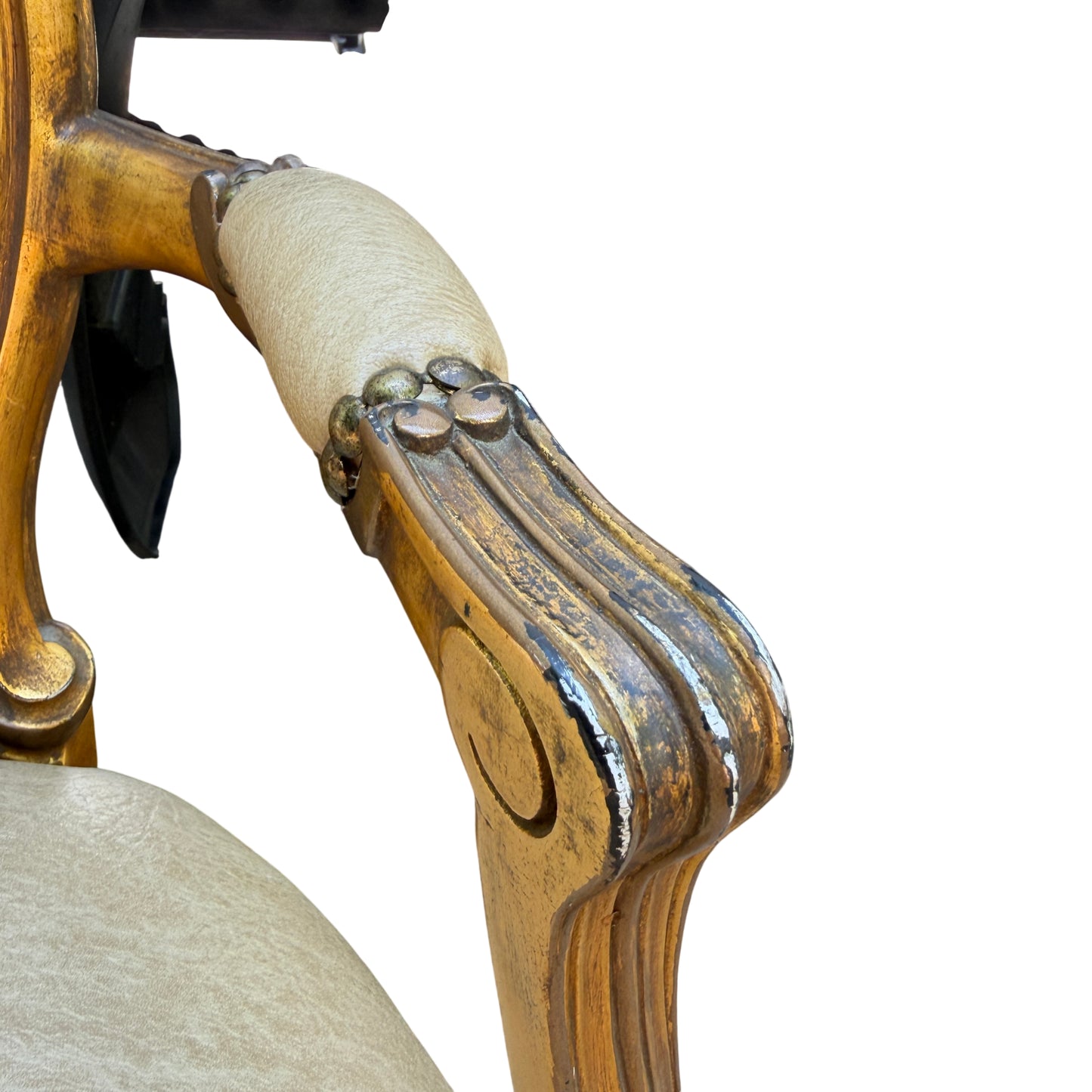 Castor and leg detail on gilt armchair showing green paint on the castor and wear to finish