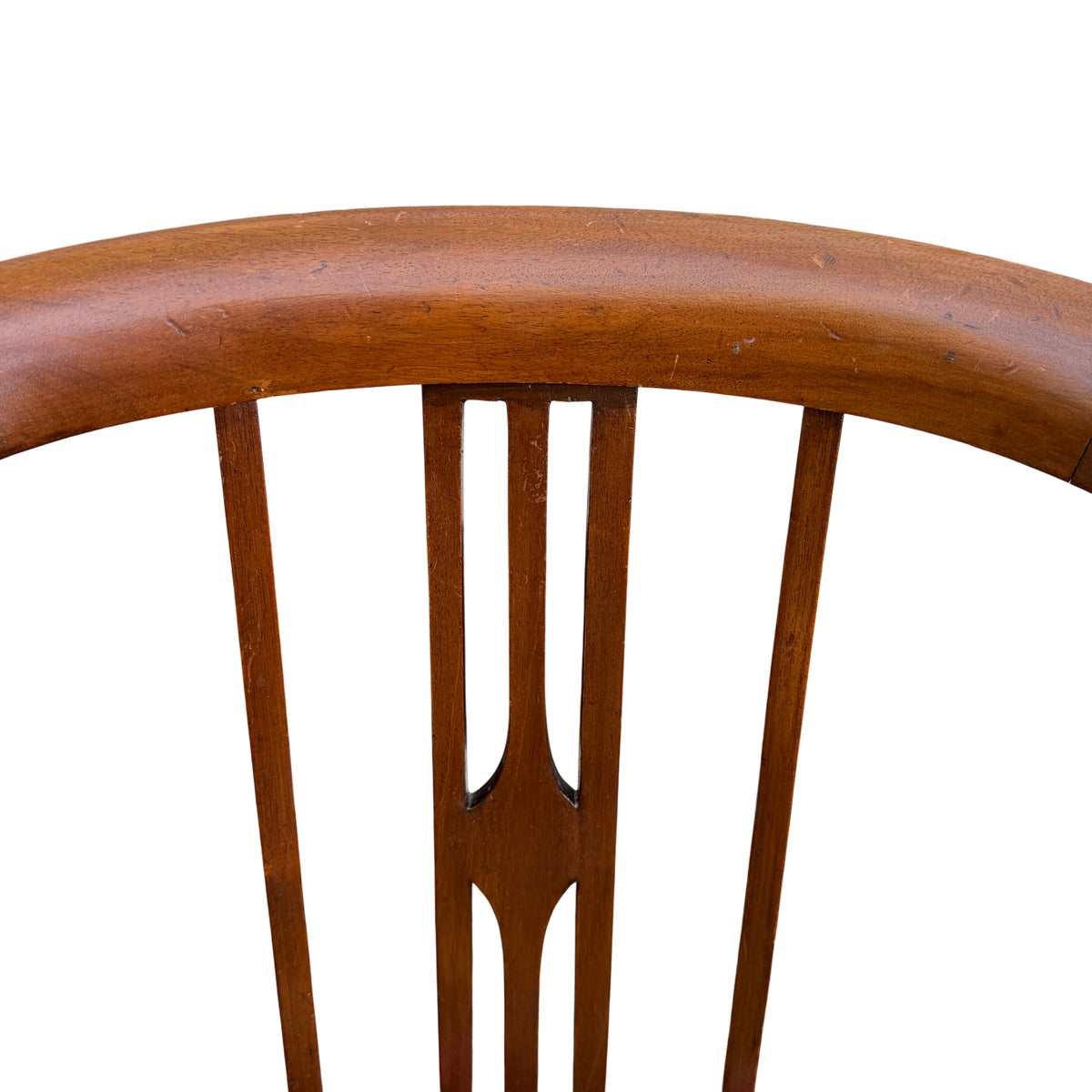 Front view of Arts & Crafts armchair showing carved legs and floral needlepoint seat