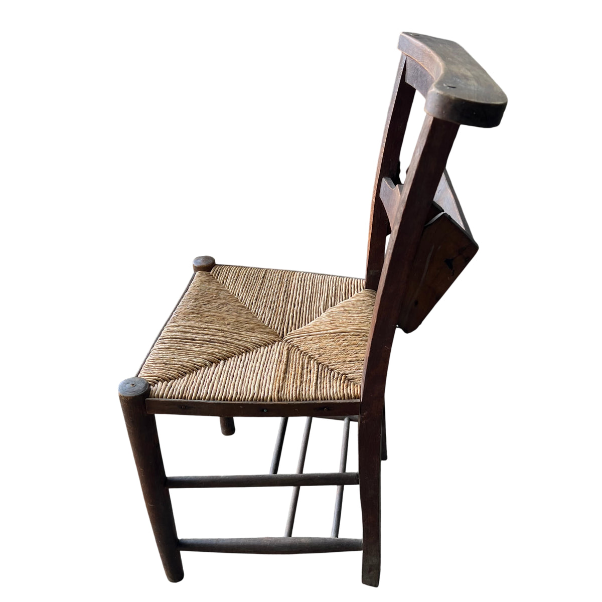 Rear view of rustic wooden dining chair showing curved top rail and slat