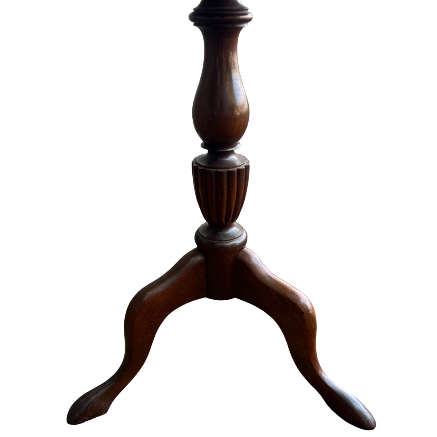 Close up of red leather tabletop with visible wear and tooling on Victorian pedestal table