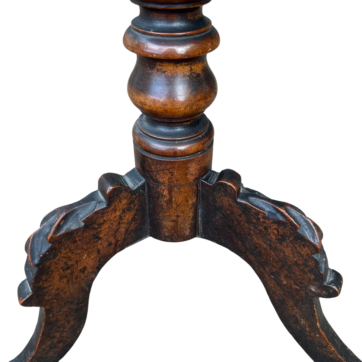 Three-quarter view of octagonal top and turned column on an occasional table