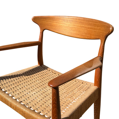 Detail of woven paper-cord seat showing rope pattern and edge finish