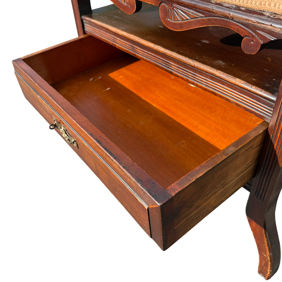 Close-up of upholstered seat and decorative braid trim on Victorian stool