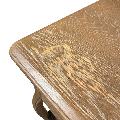 Scalloped apron detail and curved leg profile on contemporary bedside table