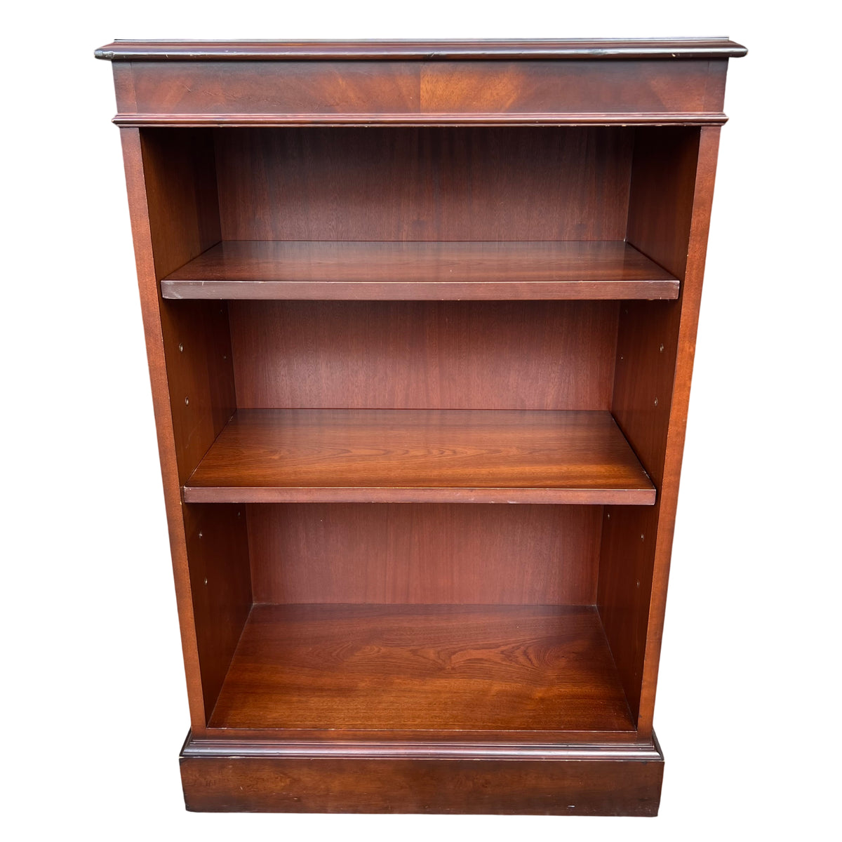 Front view mahogany veneer bookcase by Brights of Nettlebed with three shelves