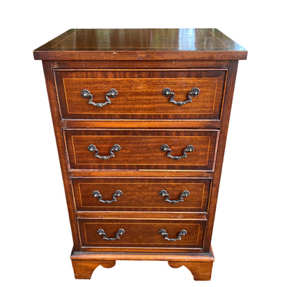 Close detail of the top two drawers showing inlaid stringing and brass swan-neck handles