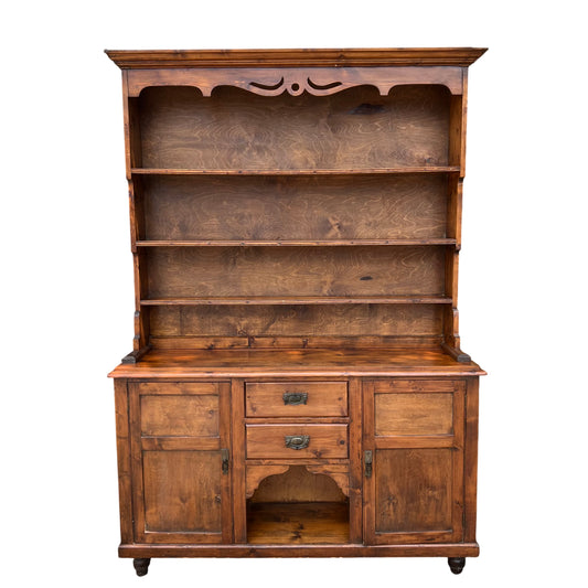 Tall vintage pine dresser with three open shelves and cupboard base in warm stained finish