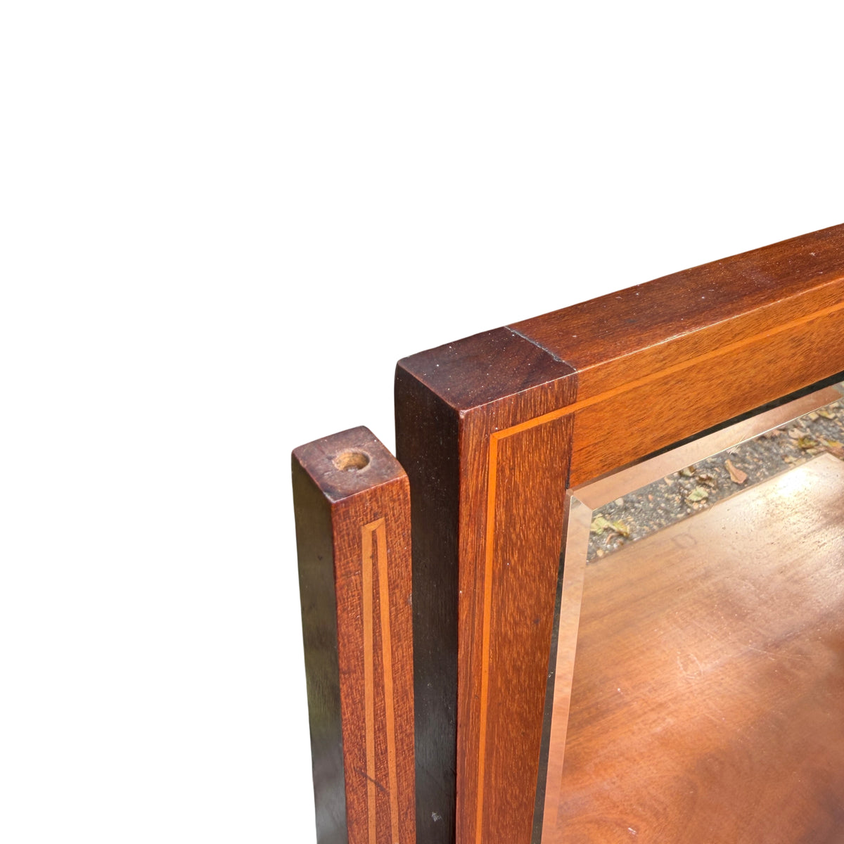 Removable mirrored top on mahogany chest showing inlay and mirror frame