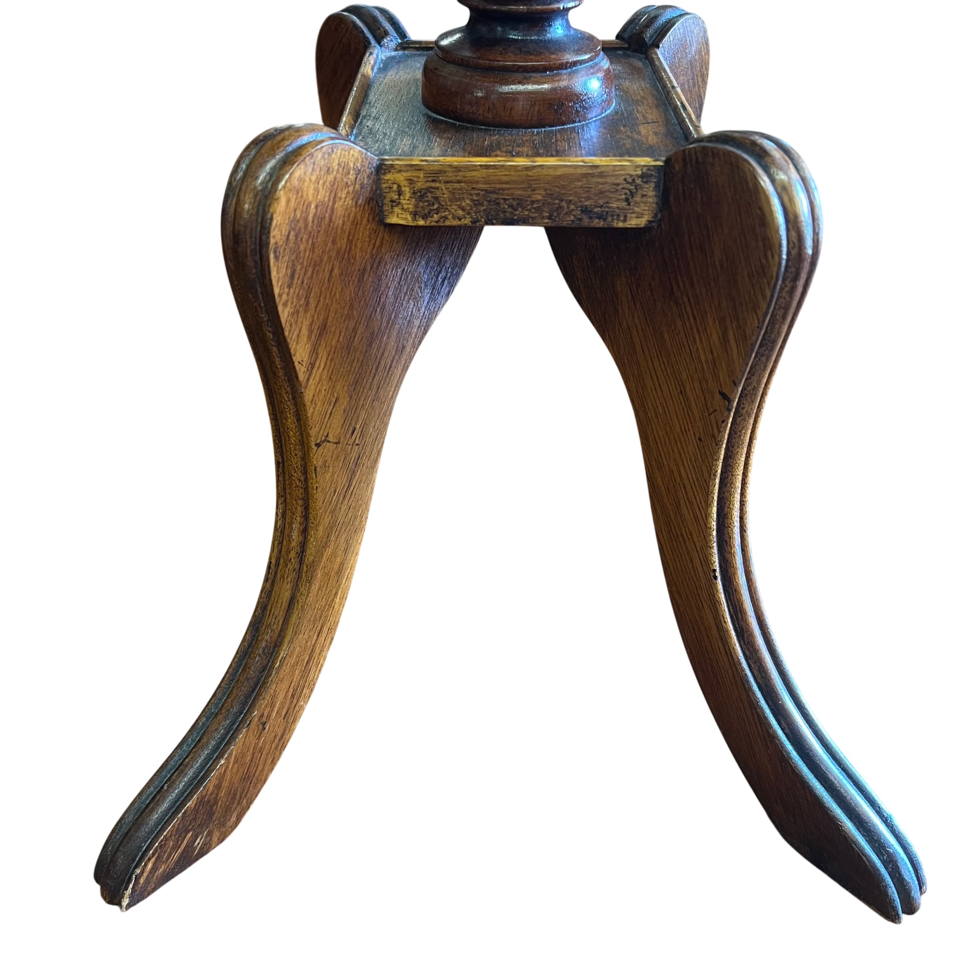 Tripod splayed feet and carved supports on a Victorian pedestal table base