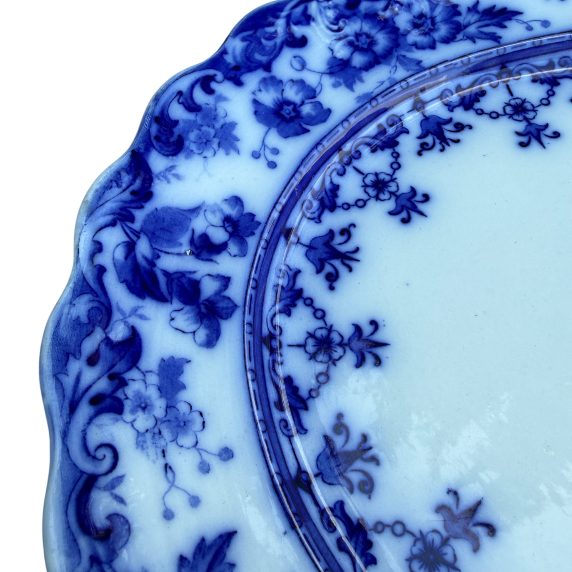 Centre detail of blue and white transferware platter showing floral garland motif
