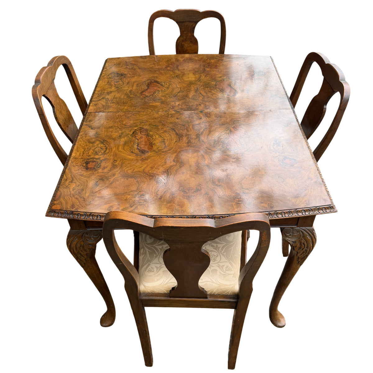 Burr walnut veneer tabletop showing swirling burr grain and extension seam