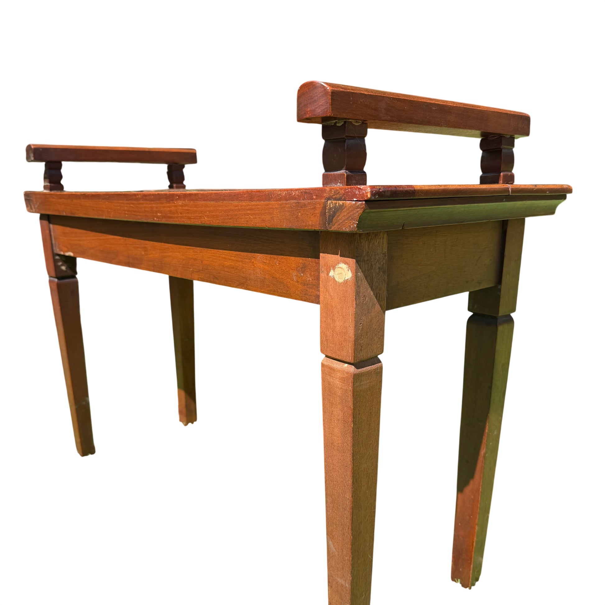 Top detail of mahogany serving table with moulded edge and surface wear