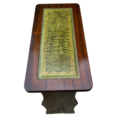 Narrow mahogany cabinet with green leather inset top and moulded edge detail