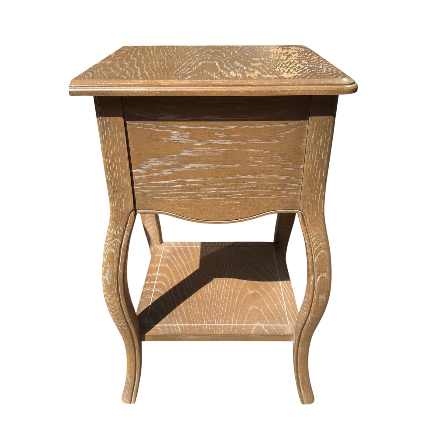 Lower shelf and stretcher visible between legs of bedside cabinet