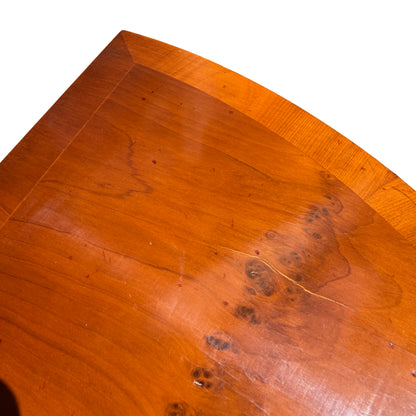 Close-up of tapered leg showing inlaid stringing and warm mahogany finish