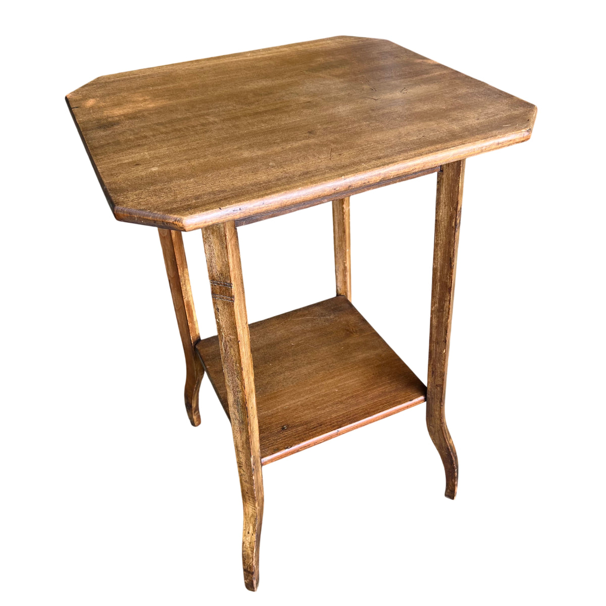 Octagonal top of an Arts & Crafts oak hall table showing wood grain and worn finish