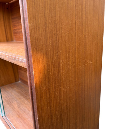 Display cabinet with two-tier shelving and sliding glass doors