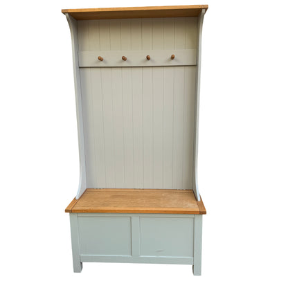 Front view painted hall bench with vertical tongue-and-groove backboard and four wooden pegs