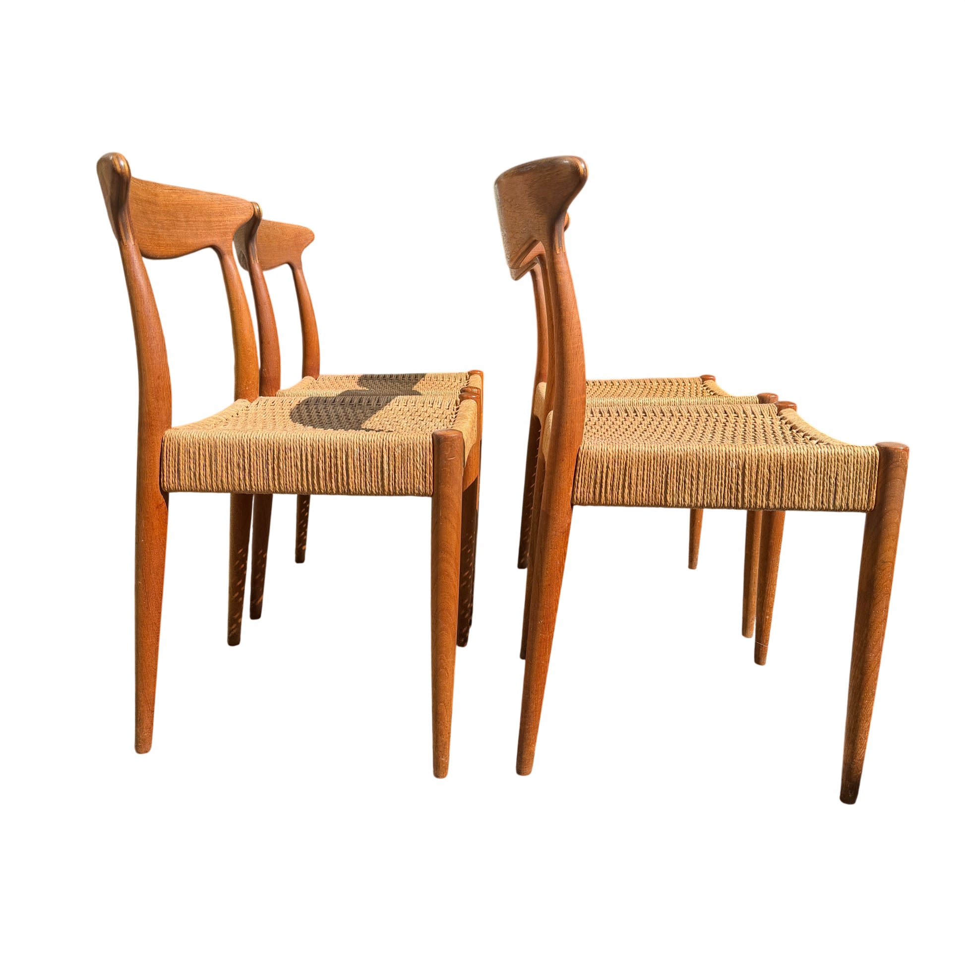 Pair of Mid Century Danish dining chairs showing paper cord seats and tapered legs
