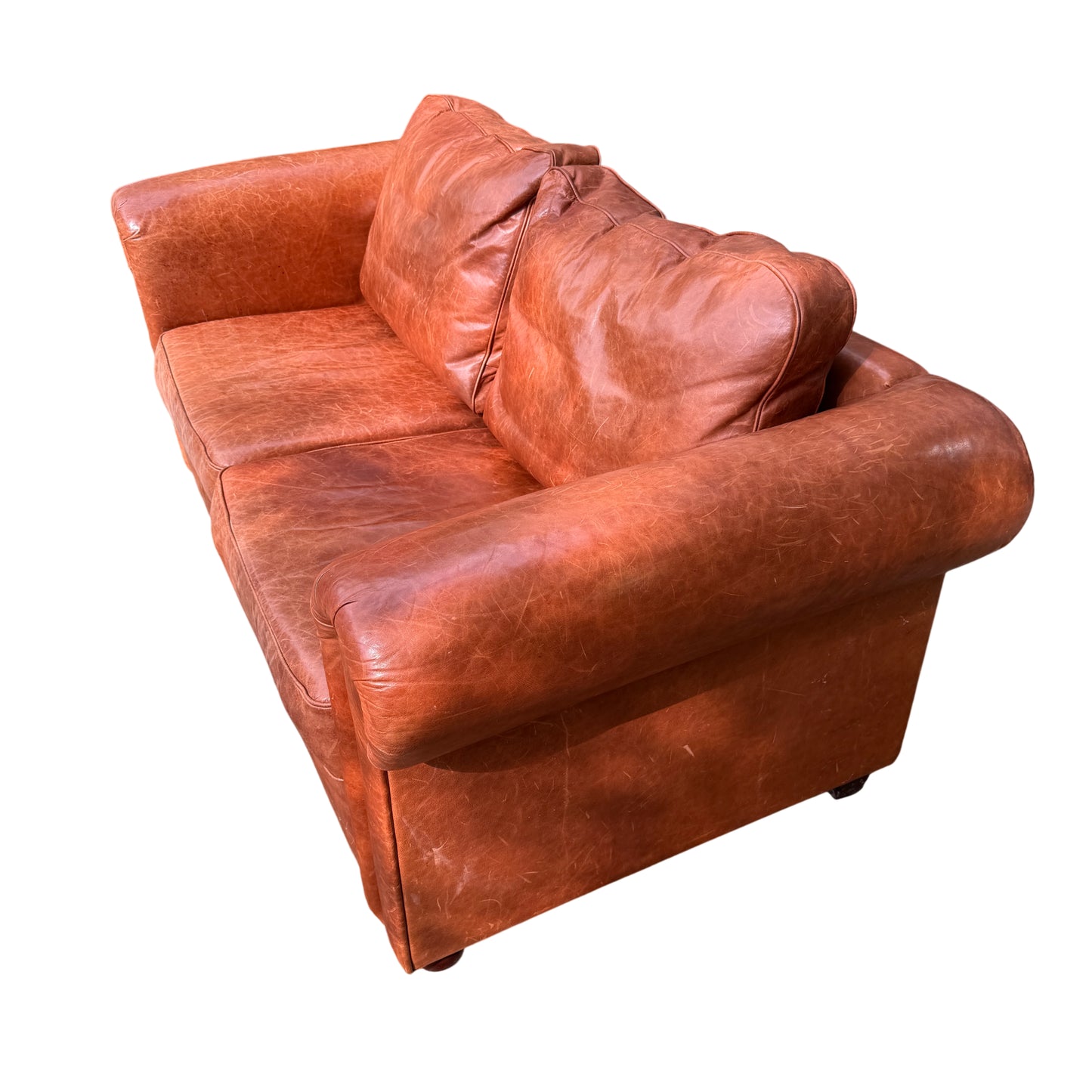 Side view showing removable turned foot and leather upholstery on two-seater sofa