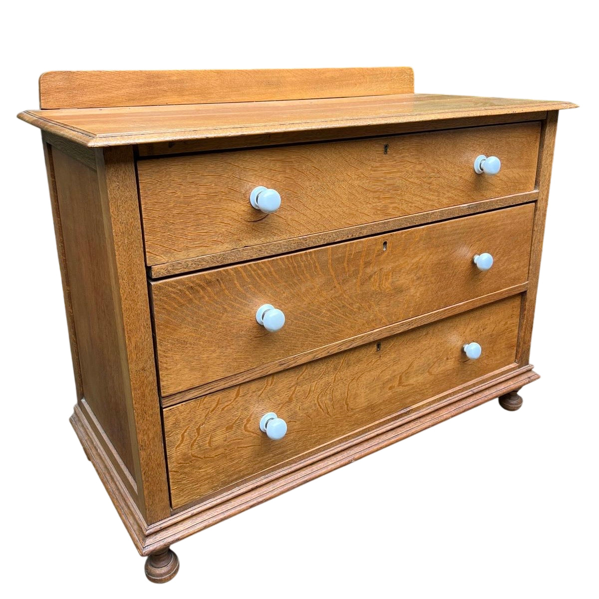Arts & Crafts solid oak chest of drawers three long drawers with bun feet and white ceramic knobs