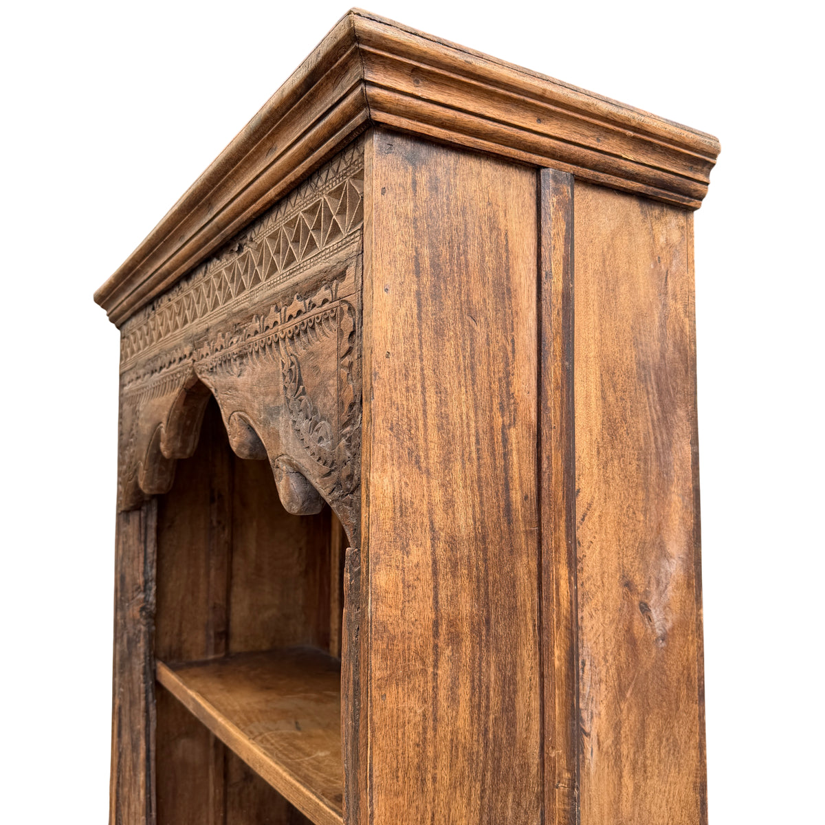 Worn surface and small cracks visible in carved oak bookcase detail