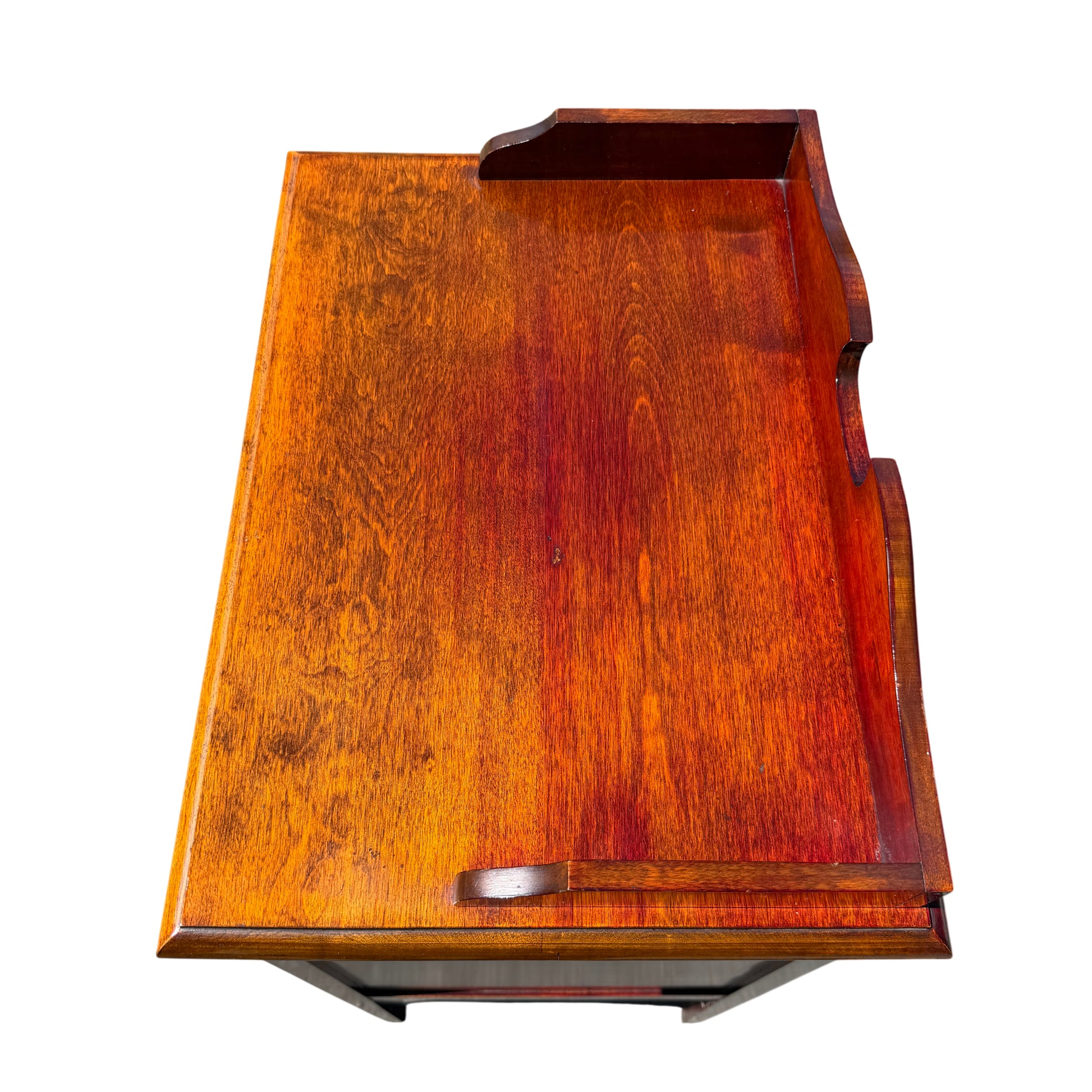 Front view of multiple shallow drawers with circular ring pulls on music cabinet