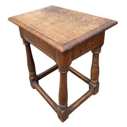 Top view of oak side table showing grain and pegged edge detail