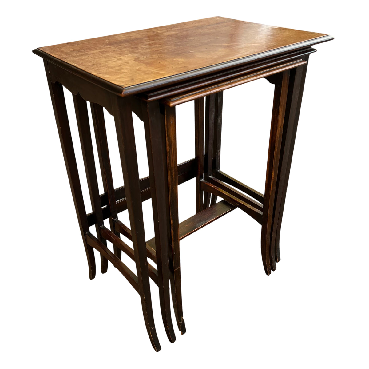 Set of three vintage wooden nesting tables with light tops and dark stained frames
