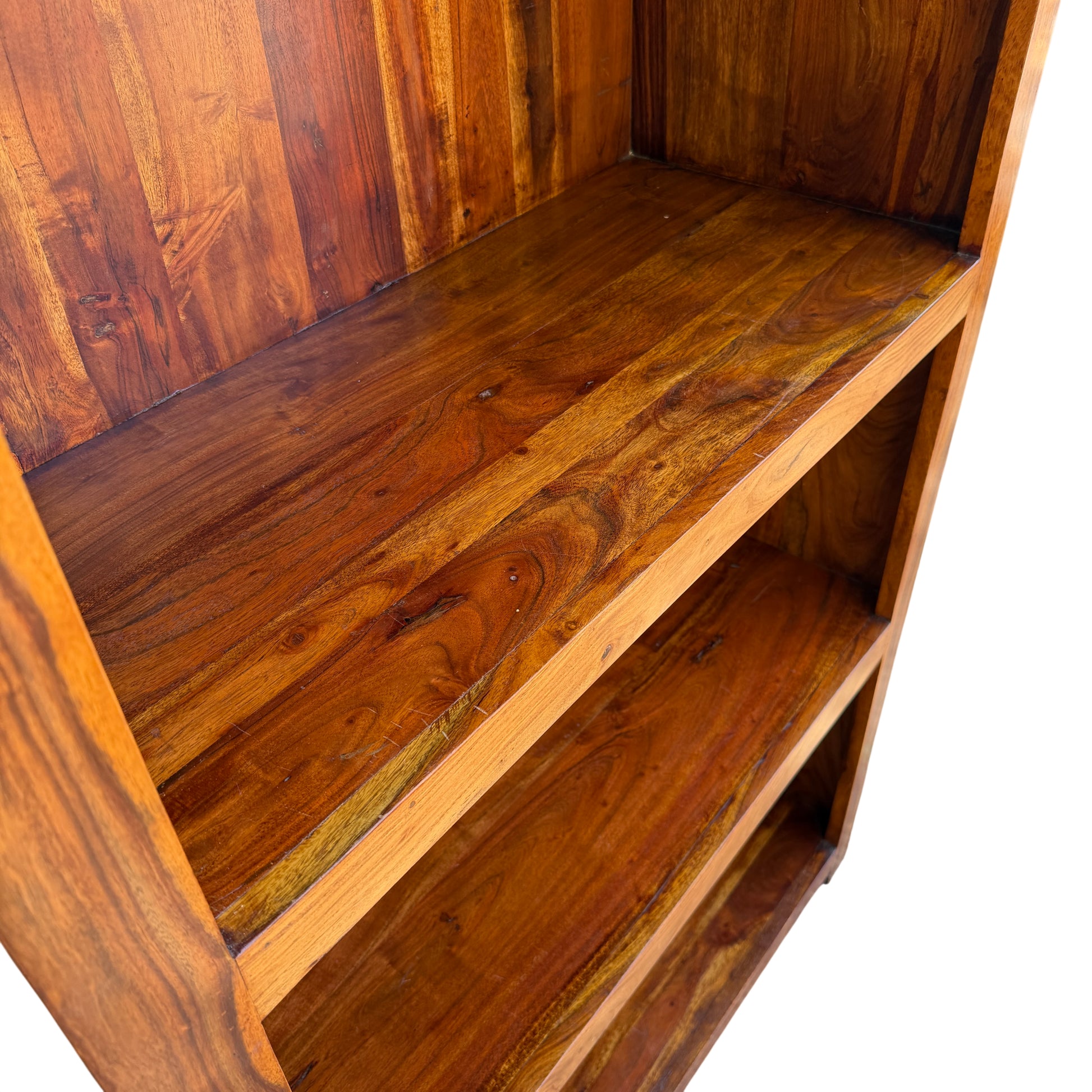 Open shelving bookcase with warm oil-like finish and deep shelves
