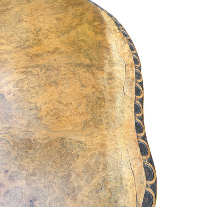 Underside and edge detail of burr walnut table top and carved trim