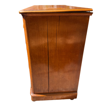 Profile view of turned wooden knobs and drawer fronts on pine chest