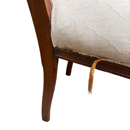 Lower detail showing scuffed legs and stretchers on an antique dining chair