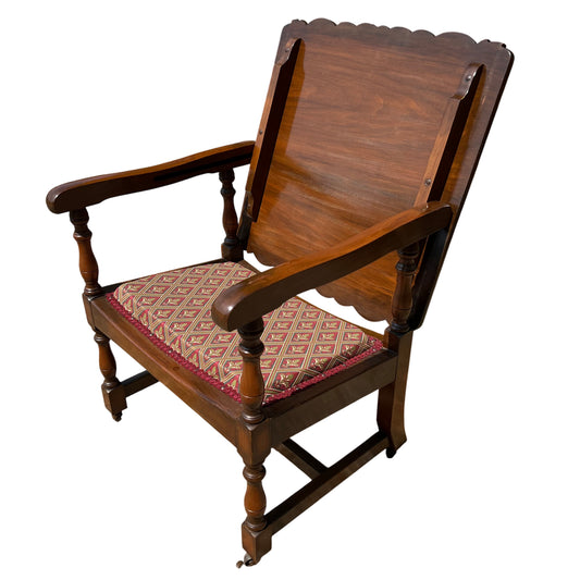Vintage wooden armchair with scalloped back, turned legs and patterned upholstered seat