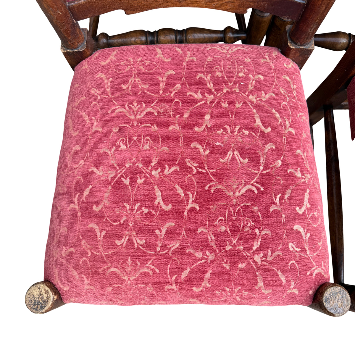 Detail of turned front leg and stretcher on a vintage oak dining chair