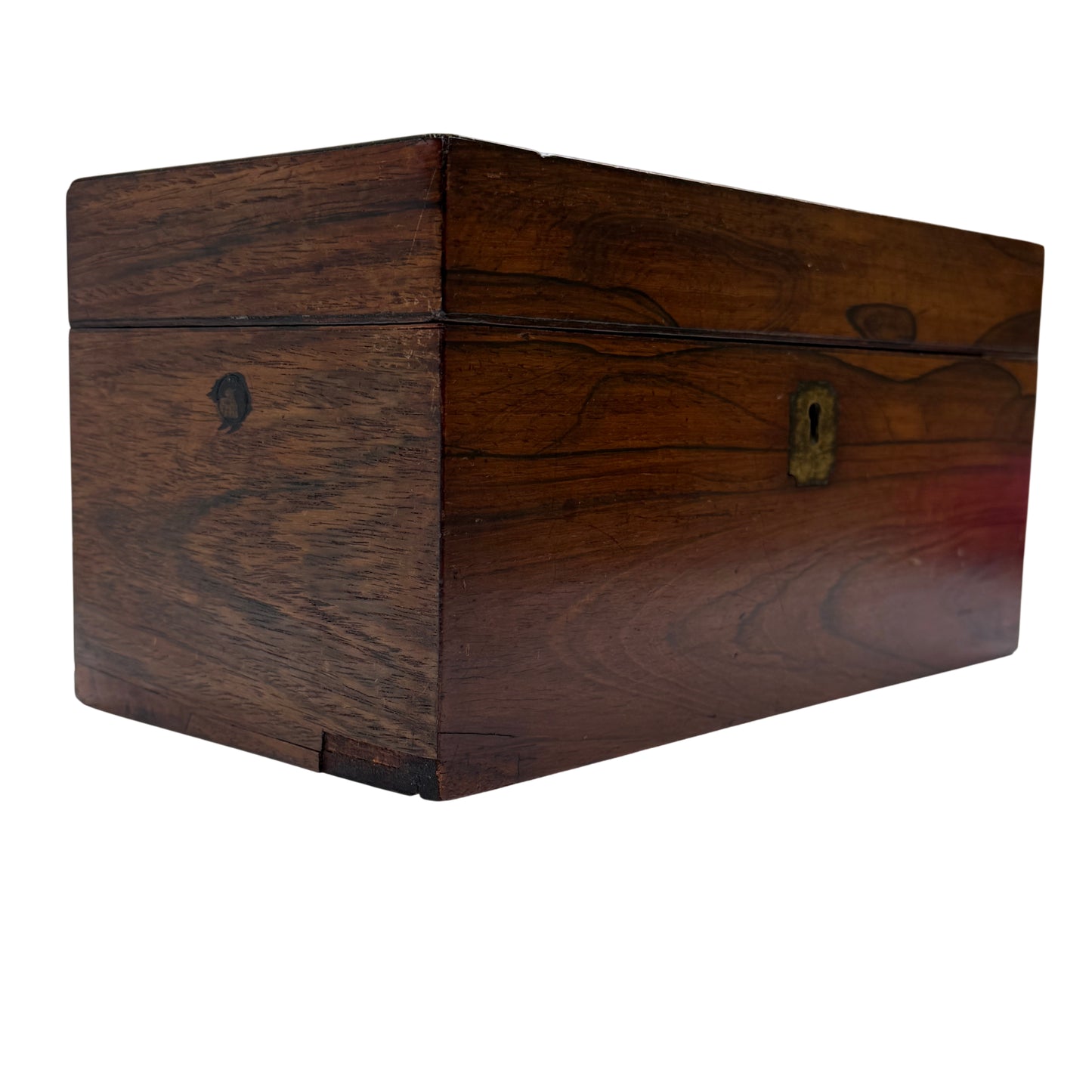 Edge detail of rosewood tea caddy showing small chip to left‑hand corner