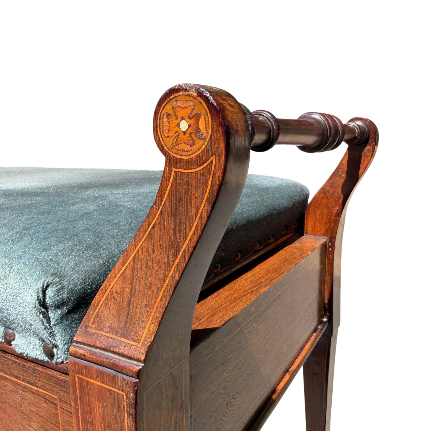 Three-quarter view of storage bench on street with tapered legs visible